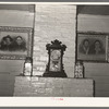 Mantle and ancestral portraits in home of Cajun farmer near Crowley, Louisiana