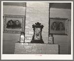 Mantle and ancestral portraits in home of Cajun farmer near Crowley, Louisiana