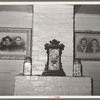 Mantle and ancestral portraits in home of Cajun farmer near Crowley, Louisiana