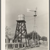 Windmill and water tower from which running water is available in home of Joseph La Blanc. Near Crowley, Louisiana