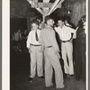 Fais-do-do dance. Cajun men congregate in center of hall. Near Crowley, Louisiana