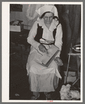 Madame Dronet carding cotton. Erath, Louisiana