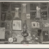 Decorations above mantle in Negro home along the levee. Norco, Louisiana. Note the life insurance policies