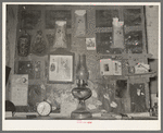 Decorations above mantle in Negro home along the levee. Norco, Louisiana. Note the life insurance policies