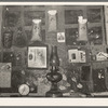 Decorations above mantle in Negro home along the levee. Norco, Louisiana. Note the life insurance policies