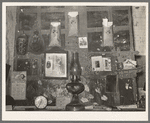 Decorations above mantle in Negro home along the levee. Norco, Louisiana. Note the life insurance policies