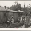 Fisherman's family returning from early morning's fishing near Akers, Louisiana