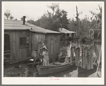 Fisherman's family returning from early morning's fishing near Akers, Louisiana