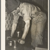 Pressing top onto tin can full of syrup. Syrup mill near New Iberia, Louisiana