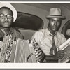 Negro musicians in car playing accordion and washboard and singing. Near New Iberia, Louisiana