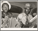 Negro musicians in car playing accordion and washboard and singing. Near New Iberia, Louisiana