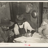 End of hand of poker played by day laborers at home near New Iberia, Louisiana