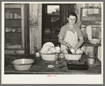 Mrs. M. LaBlanc washing dishes in kitchen of her present home. Morganza, Louisiana