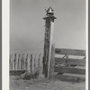 Old bell on sugarcane plantation near Gibson, Louisiana