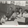 Negro children playing with chalk in nursery school. Lakeview Project, Arkansas