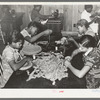 Pupils at school making rag rugs. Lakeview Project, Arkansas