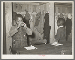 Children in nursery school drinking orange juice. This is given to them every morning at school. Lakeview Project, Arkansas