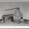Barn with farmer and livestock. Lakeview Project, Arkansas