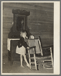 A child of Scarbrough's in front of dresser. Laurel, Mississippi
