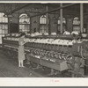 General view of machines where cotton thread is wound onto spools from spindles. Laurel Mills, Laurel, Mississippi