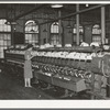 General view of machines where cotton thread is wound onto spools from spindles. Laurel Mills, Laurel, Mississippi