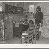 Negro mother teaching children numbers and alphabet in home of sharecropper. Transylvania, Louisiana