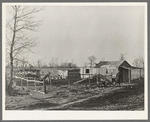 Farmstead of Negro sharecropper with sharecropper carrying water. Near Transylvania, Louisiana