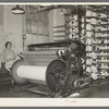 Warp winding machine with operator. Laurel mills, Laurel Mississippi