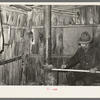 Mot Tucker making ax handles in living room of his corncrib home. Antioch, Mississippi