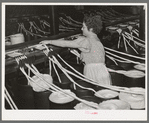 Threading cotton ropes into thread-making machine. Laurel cotton mill, Laurel, Mississippi