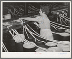 Threading cotton ropes into thread-making machine. Laurel cotton mill, Laurel, Mississippi