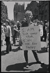 Donna Gottschalk holds "I am your worst fear I am your best fantasy" poster at Christopher Street Gay Liberation Day parade, 1970