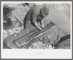 Prospector working the sluice box, Pinos Altos, New Mexico