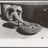 Changing tire at the garage, Pie Town, New Mexico