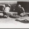 Changing tire at the garage, Pie Town, New Mexico