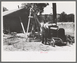 Farmer and his wife drilling water well with cable tools, Pie Town, New Mexico