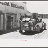 Stage driver unloading packages at general store, Pie Town, New Mexico