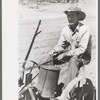 Faro Caudill planting beans, Pie Town, New Mexico