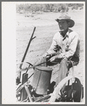 Faro Caudill planting beans, Pie Town, New Mexico