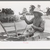 Mr. Leatherman starting for home in his burro-drawn cart. The handles of the cart belong to a homemade terracing implement belonging to Mr. Craig who loaned it to Leatherman to do his terracing, Pie Town, New Mexico
