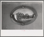 Picture of their farm home in Oklahoma. Hanging in living room of the George Huttons, Pie Town, New Mexico