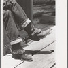 Detail of farmer's blue jeans, boots and spurs. This man was once a cowboy and still prefers the cowboy's dress, Pie Town, New Mexico