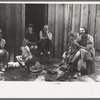 Farm women and children laughing at some antics of the menfolks. This was taken during an all day Sunday visiting to celebrate a birthday, Pie Town, New Mexico