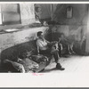 Faro Caudill and his daughter in their dugout home. There hasn't been any cash to buy furniture. Farm expenditures take all extra cash, Pie Town, New Mexico