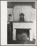 Fireplace and mantle in adobe home of homesteader, Pie Town, New Mexico