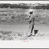 Water witch walks in the direction that stick heads him, Pie Town, New Mexico