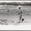 Water witch walks in the direction that stick heads him, Pie Town, New Mexico