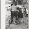 Holding boy to give him a birthday whipping, Pie Town, New Mexico