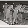 Packing grapefruit into sacks. This is common method of packing for relief distribution. Weslaco, Texas