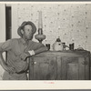 FSA (Farm Security Administration) client leaning on icebox. Hidalgo County, Texas